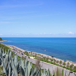 A road leads along the coast of Tangier, Morocco