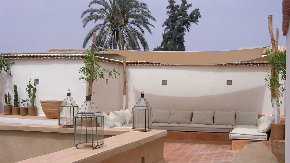 Cushioned loungers on a rooftop terrace at one of the best hotels in Taroudant