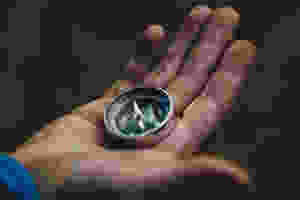 Compass in a hand ready for adventure
