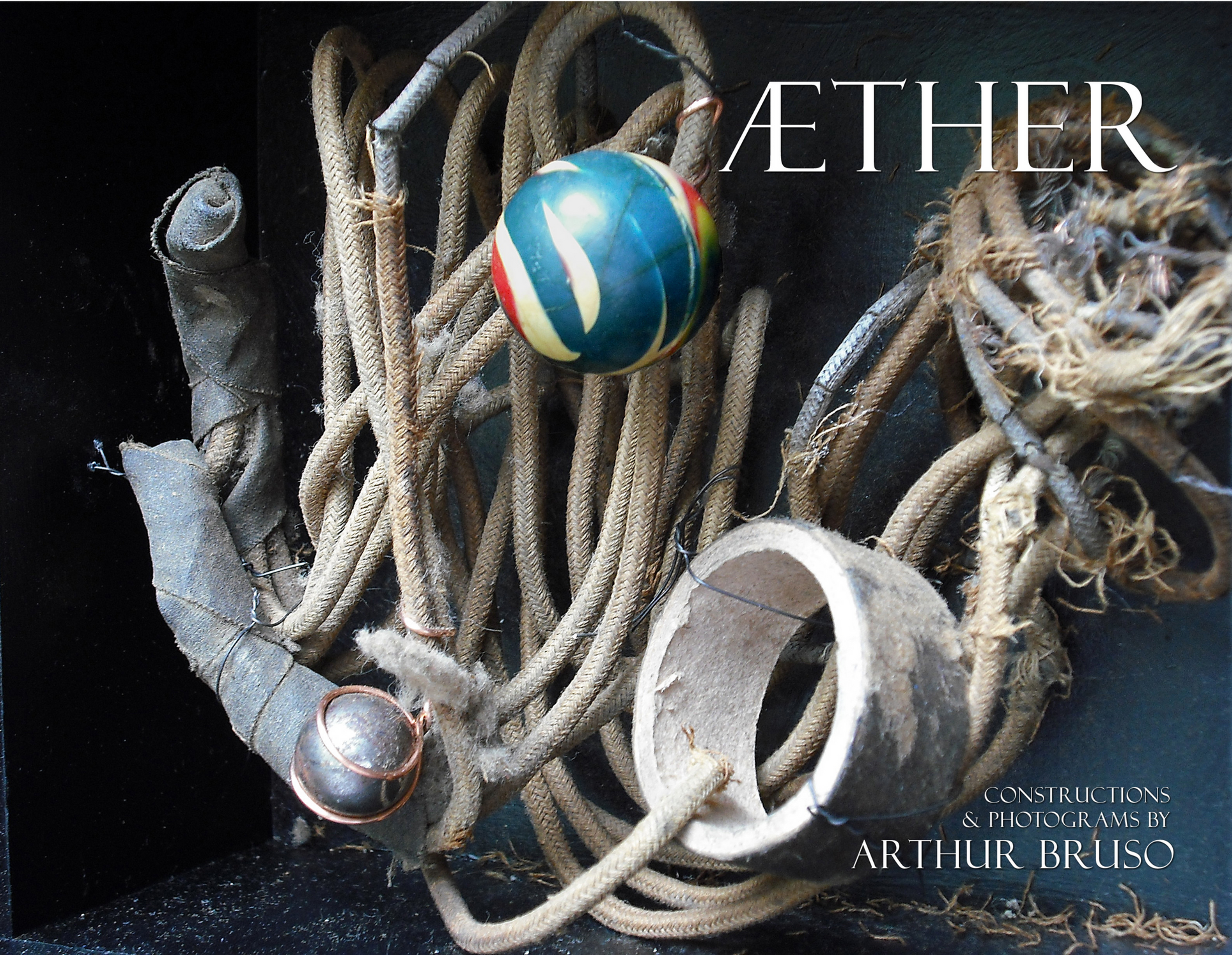Book cover with tangled wires, spheres, and the title AETHER by Arthur Bruso on a dark background.