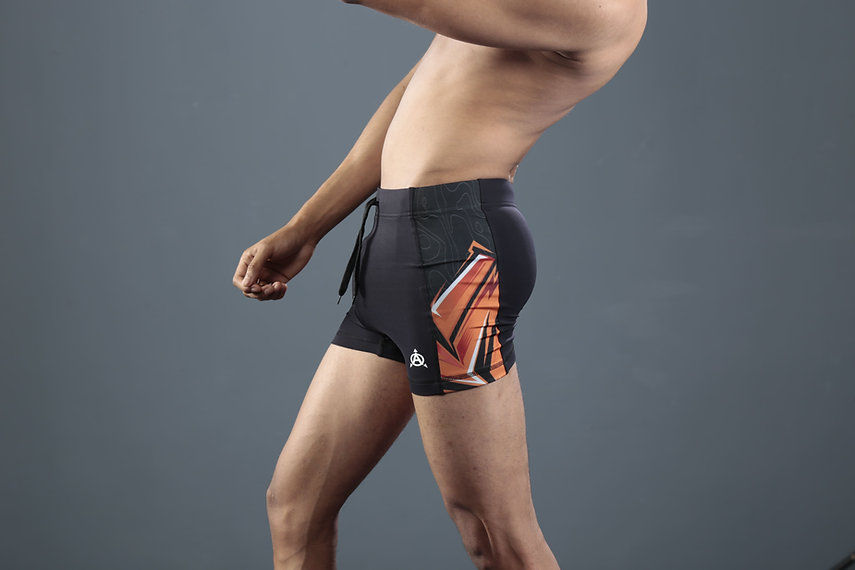 Men's black compression shorts with orange design