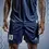 Thumbnail: Person wearing navy blue soccer shorts, number 10