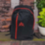 Black backpack with red accents and logo