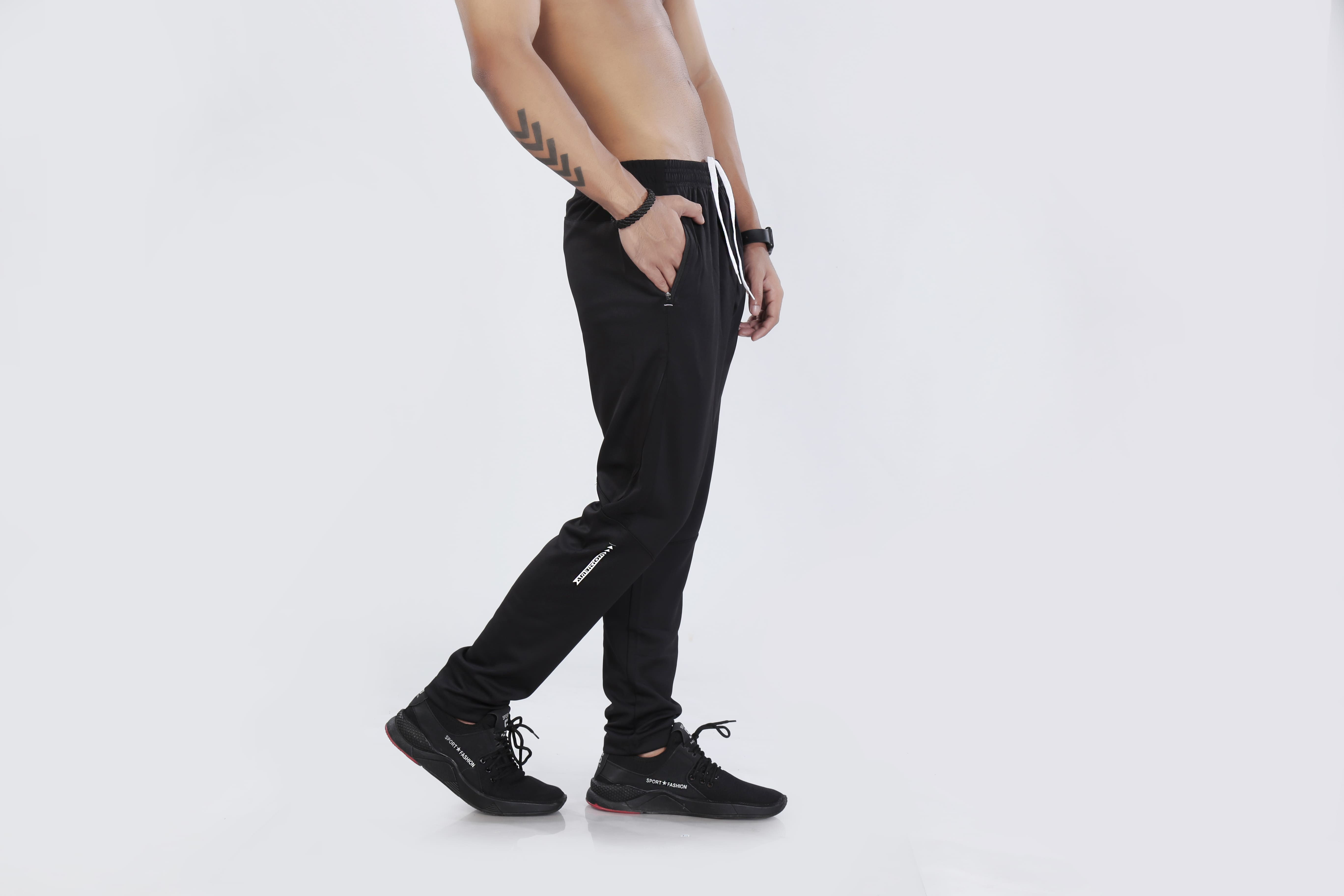 Man modeling black athletic pants