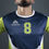 Thumbnail: Man's navy blue sports jersey with number 8