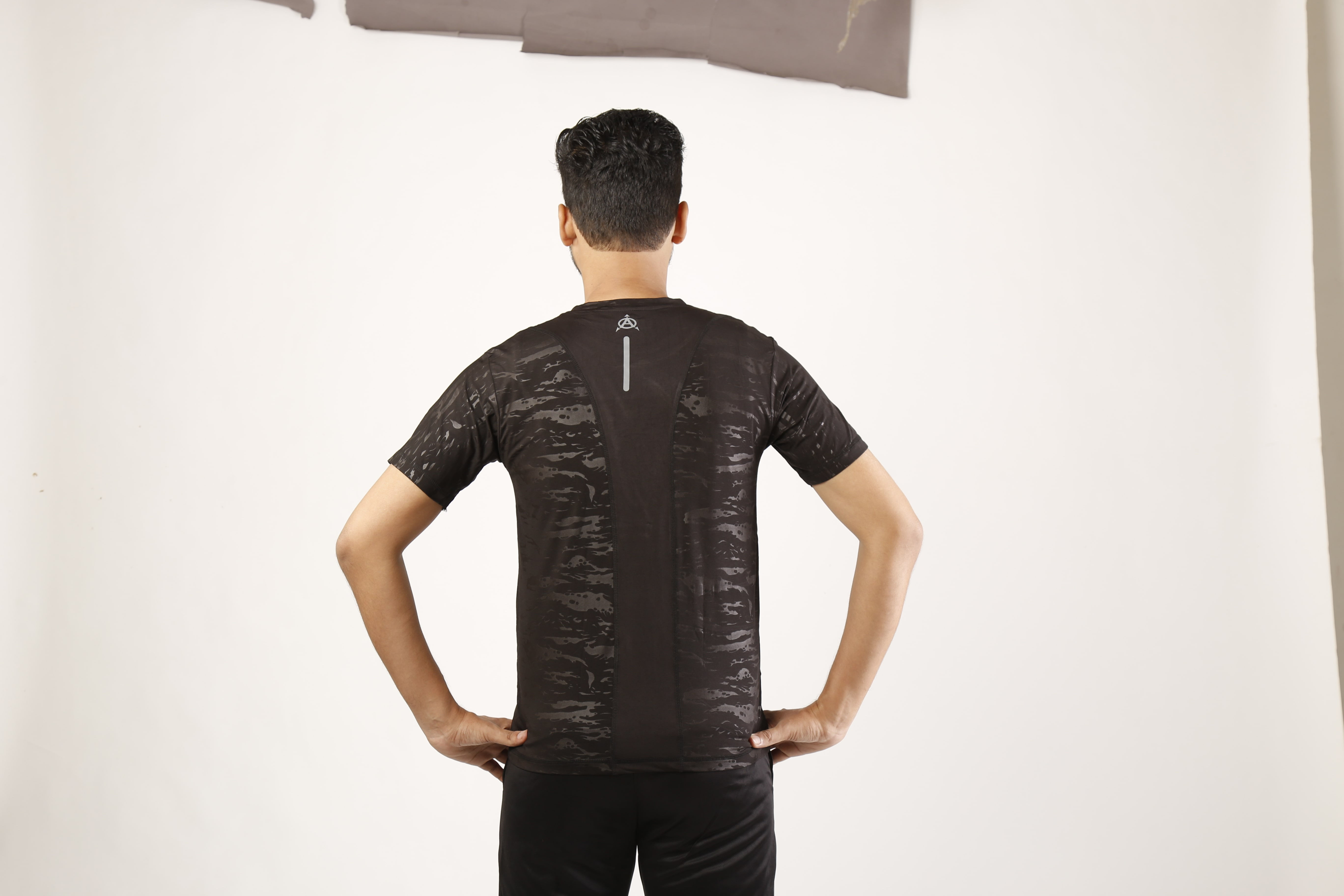 Man in black Adidas athletic shirt