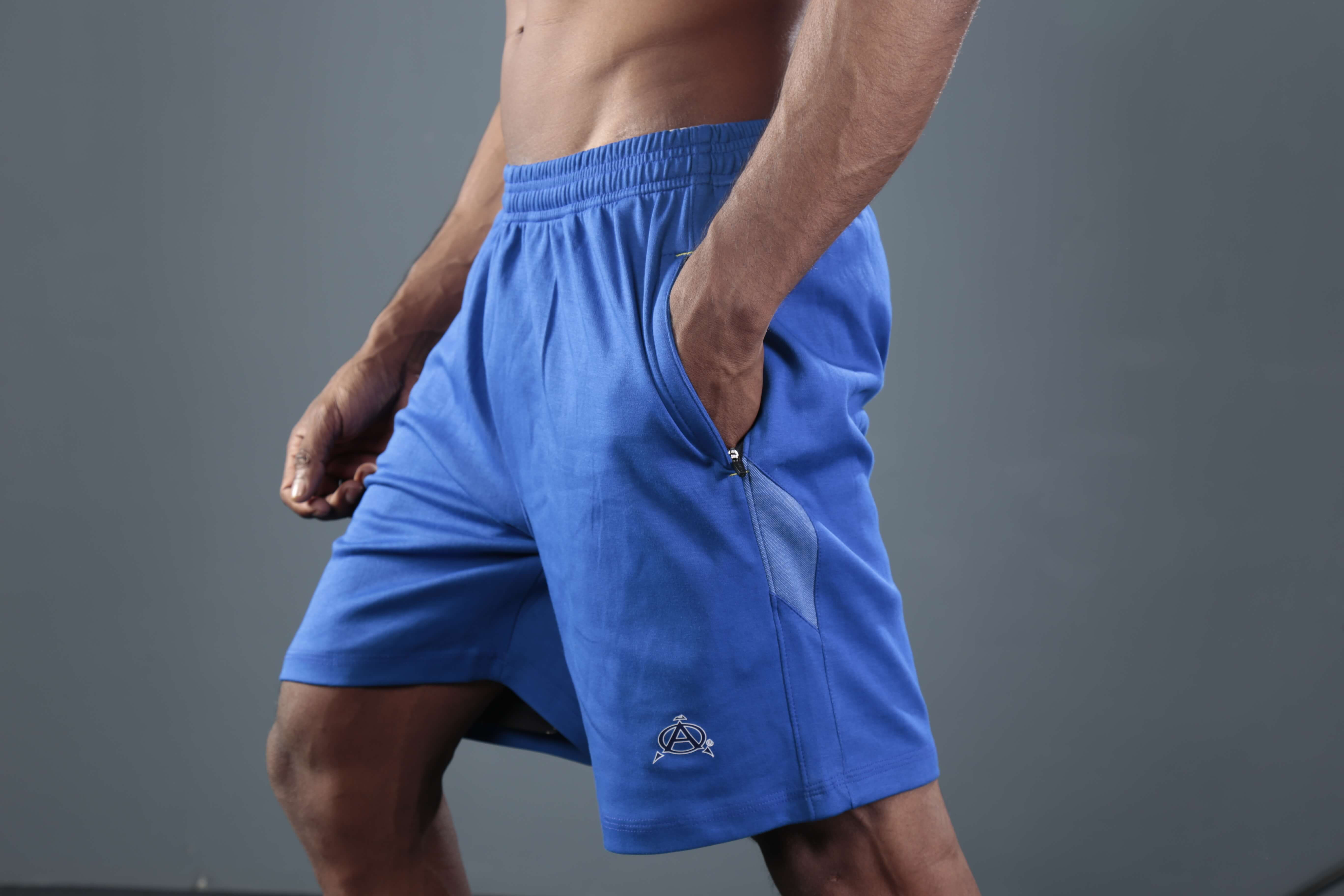 Man wearing blue athletic shorts