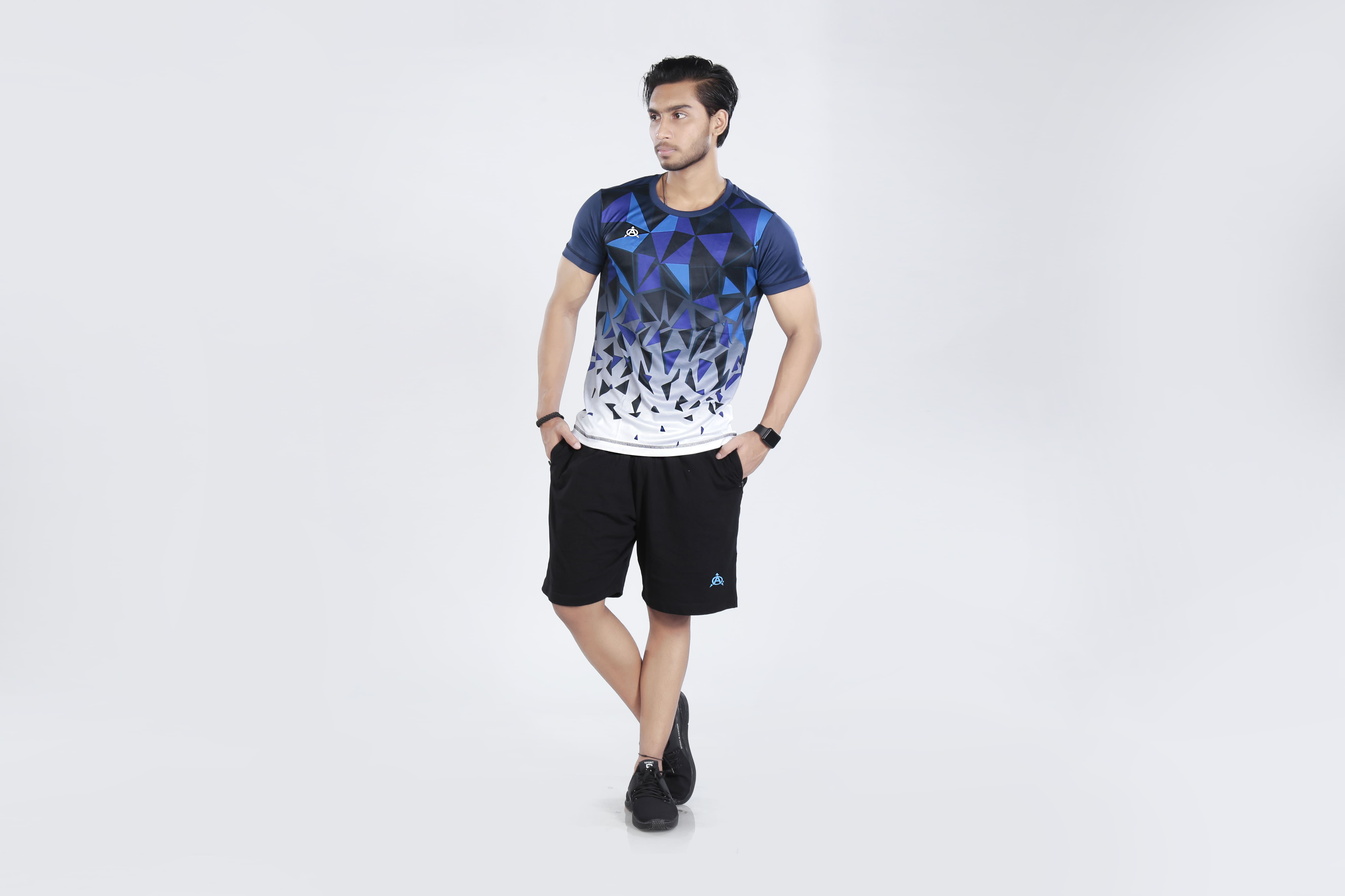 Man modeling blue and white athletic shirt and black shorts