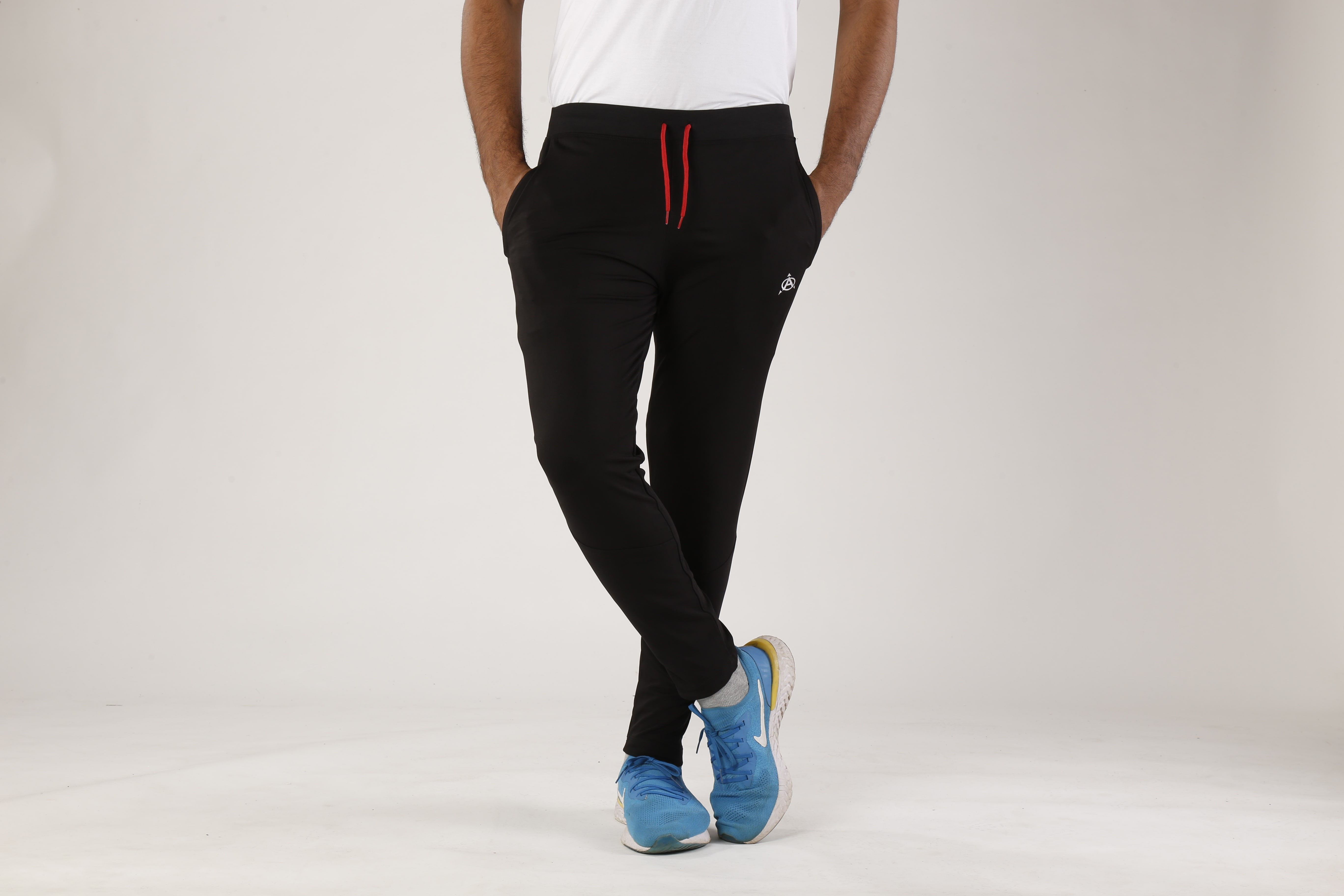 Man modeling black jogger pants