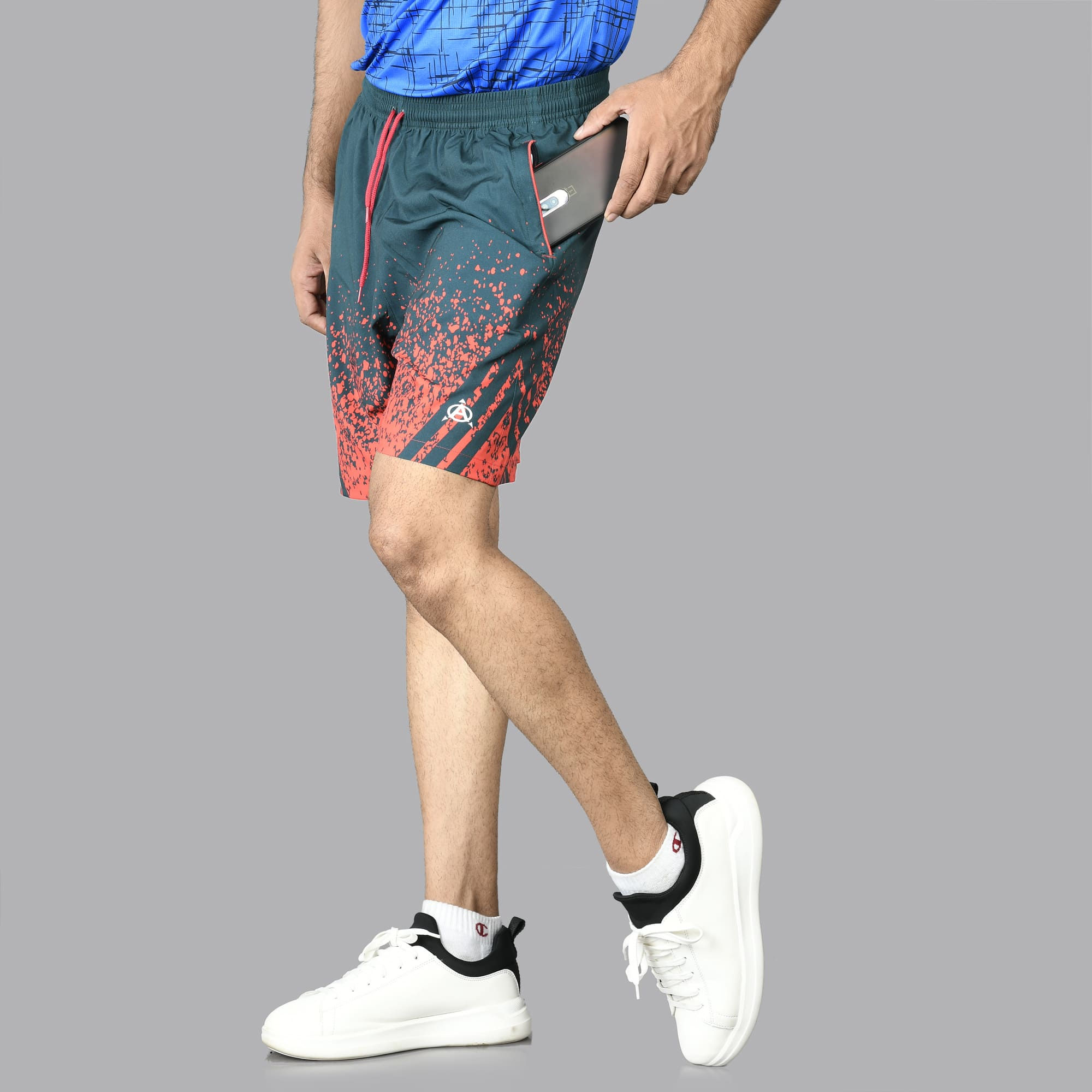 Model in dark-green printed shorts