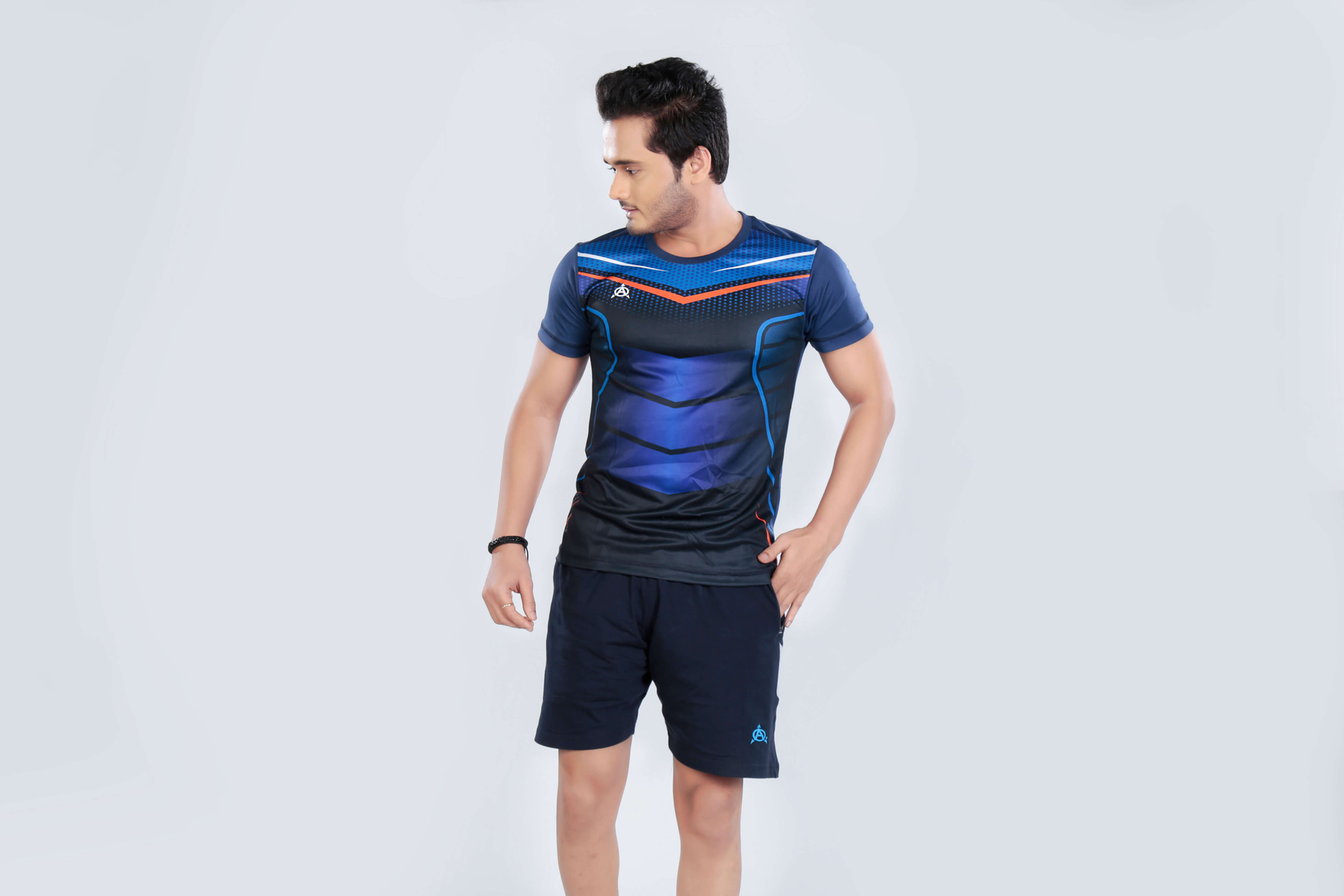 Man modeling blue athletic jersey and shorts