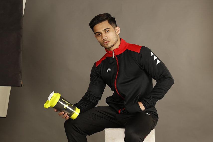 Man in black and red tracksuit
