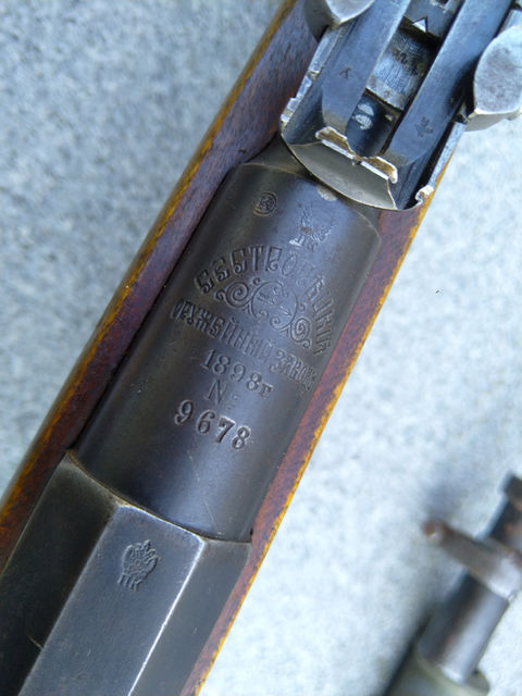 This 1898 Sestroretsk M91 was found hidden in an old house in Finland. It is likely one of the rifles that Germany shipped as aid during the Finnish civil war. Boxes of German-made 7.62x54R ammunition and a bayonet with a scabbard were found along with it, as well as an Arisaka type 38 rifle. The Mosin had a canvas sling on it that was sewn directly to a leather loop at the magazine but that unfortunately didn't survive. Recommendations for a period-correct sling setup are welcome.
The rifle has some signs of early Finnish modification, like the extra notch filed on the rear sight and i believe the nails that add tension to the barrel bands were done in Finland too. Front sight appears to be original. There are no Finnish markings on the rifle that i can see. German markings on the stock and butt plate.