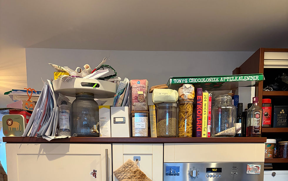Cluttered top kitchen cabinet