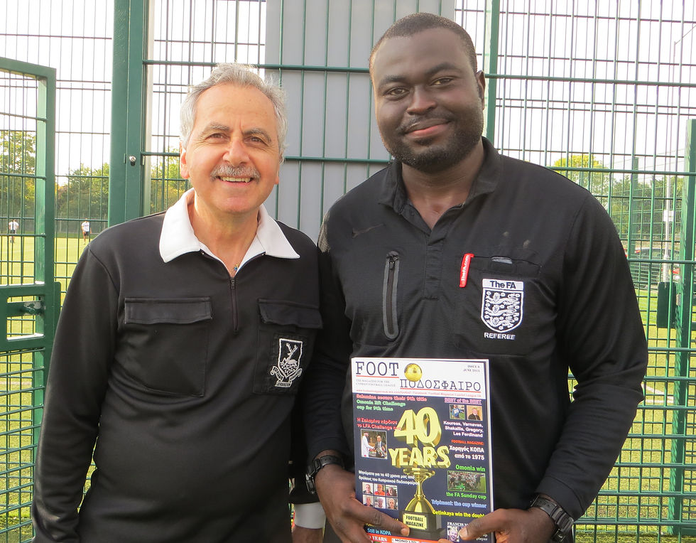 Peter Panayiotou and Wamba with our magazine.JPG