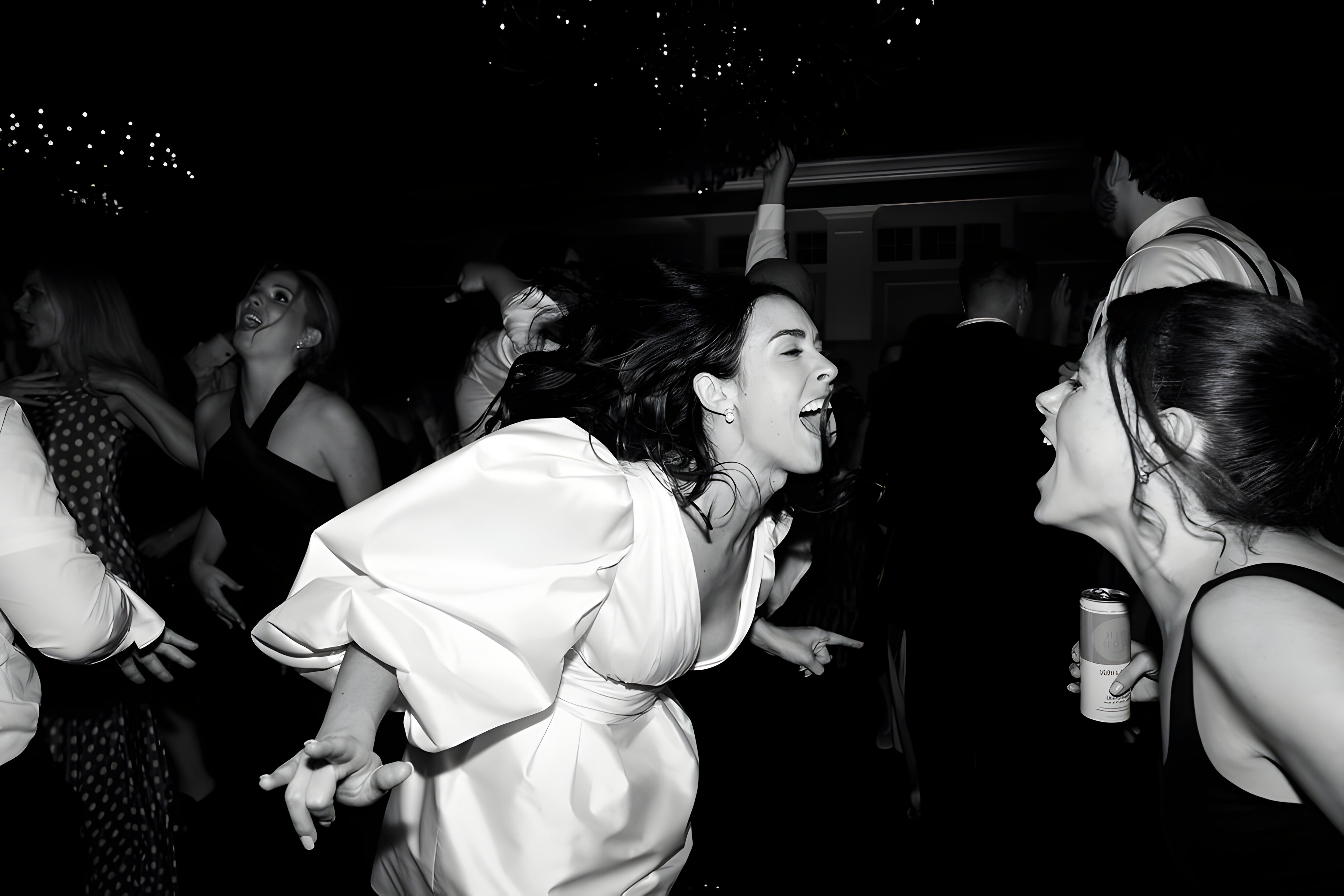 Guests celebrating on the dance floor in an AMG event photograph