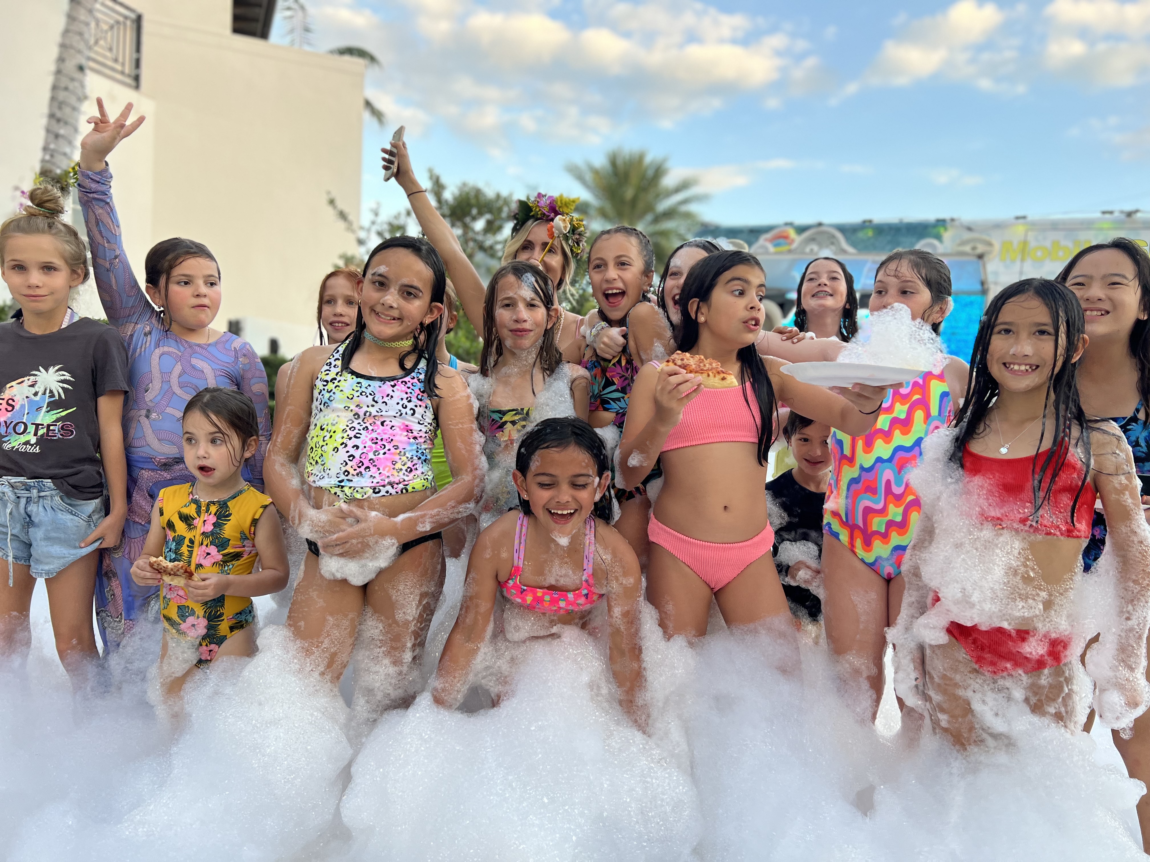 group picture of kids in foam party