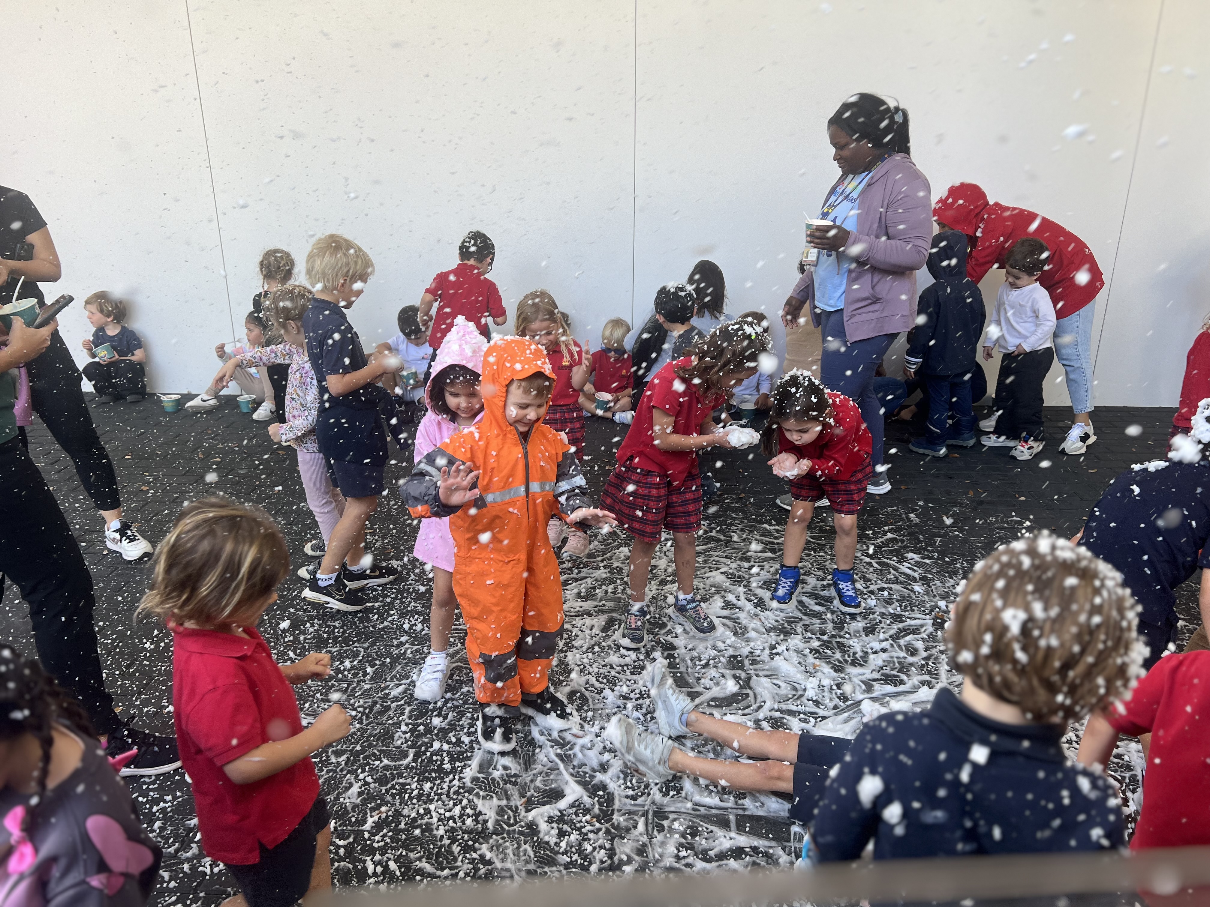 artificial snow with toddlers emjoying it