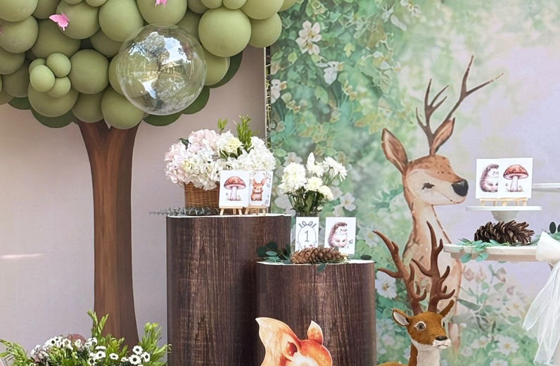 Forest birthday decor detail with balloon tree deer and flowers in Bangalore