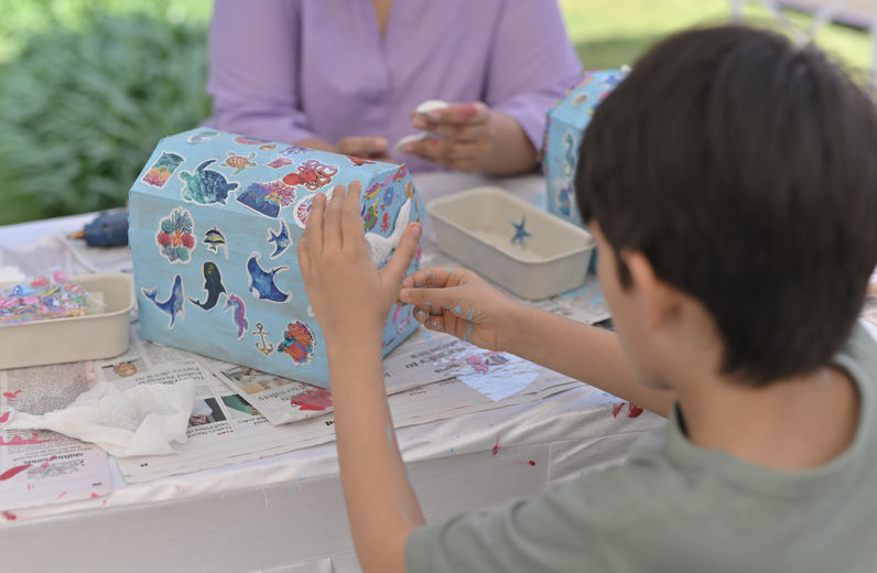Children doing under the sea themed craft activity at birthday party in Bangalore