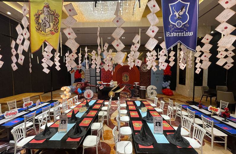 Hanging Hogwarts letters and house banners at birthday party in Bangalore