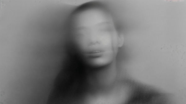 black-white-photo-womans-face-with-blurred-background (1).jpg