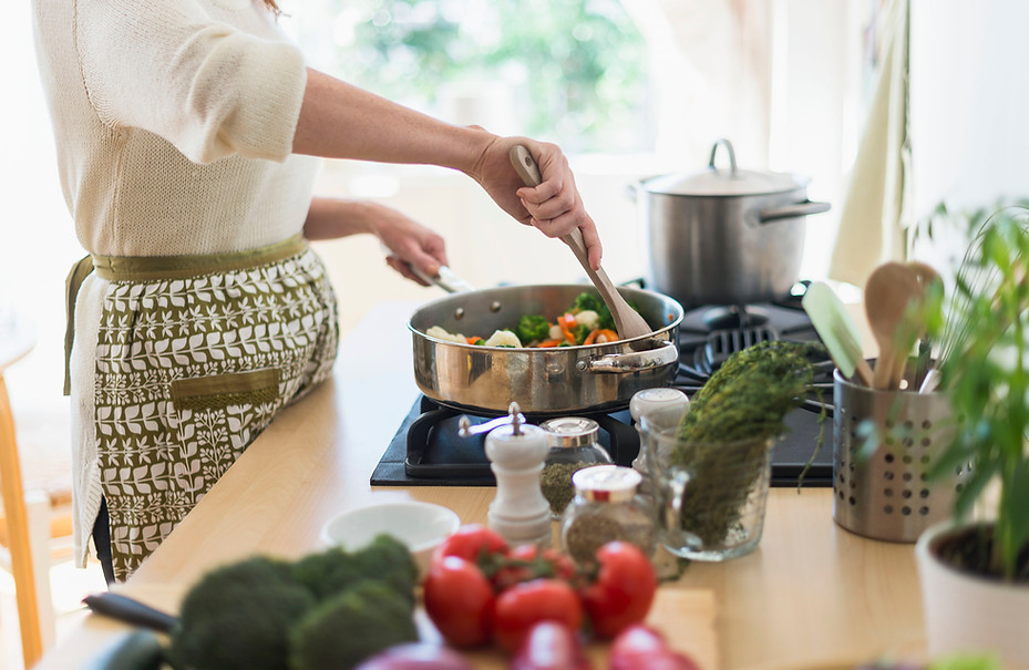 Woman Cooking in Kitchen