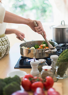 Woman Cooking in Kitchen