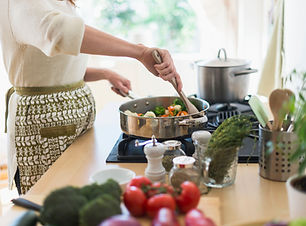 Woman Cooking in Kitchen
