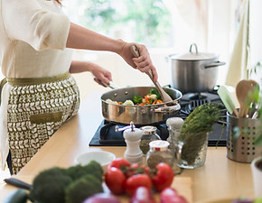 Woman Cooking in Kitchen