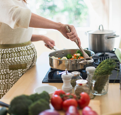 Woman Cooking in Kitchen