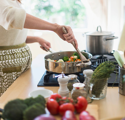 Woman Cooking in Kitchen
