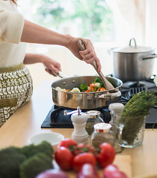 Woman Cooking in Kitchen