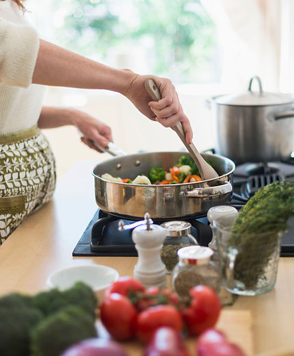 Woman Cooking in Kitchen