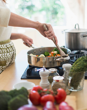 Woman Cooking in Kitchen