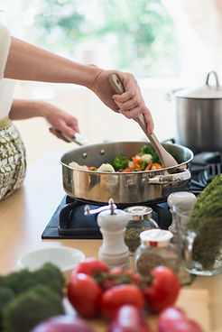 Woman Cooking in Kitchen