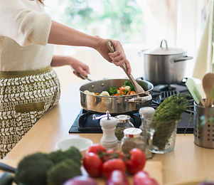 Woman Cooking in Kitchen