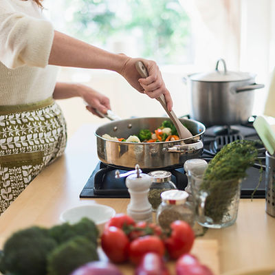 Woman Cooking in Kitchen