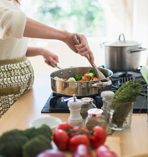 Woman Cooking in Kitchen