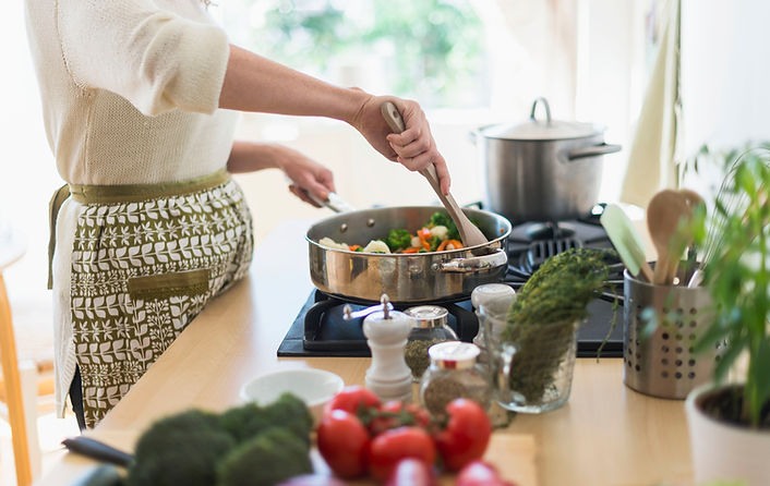 Woman Cooking in Kitchen