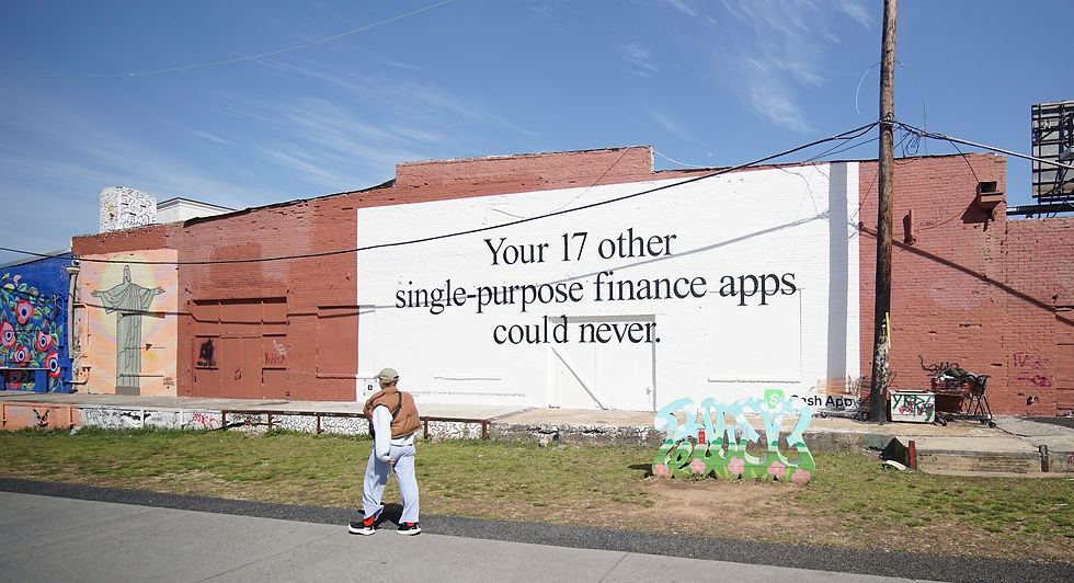 cashapp handpaint wall in atlanta GA beltline neighborhood, ad reads "your 17 other single-purpose finance apps could never." black text on white backgrounf