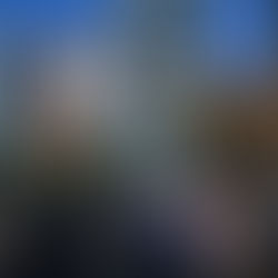 handpainted mural for wine brand chateau ste michelle in seattle washington foreground shows people shopping and walking to restaurants the wallscape is a painted bottle of wine