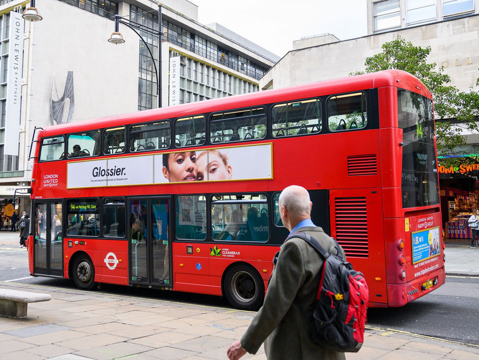 Glossier double decker bus side in London