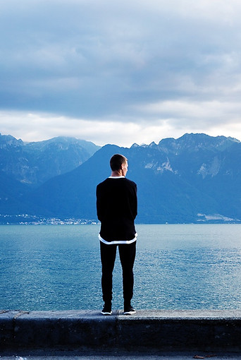 Man overlooking water