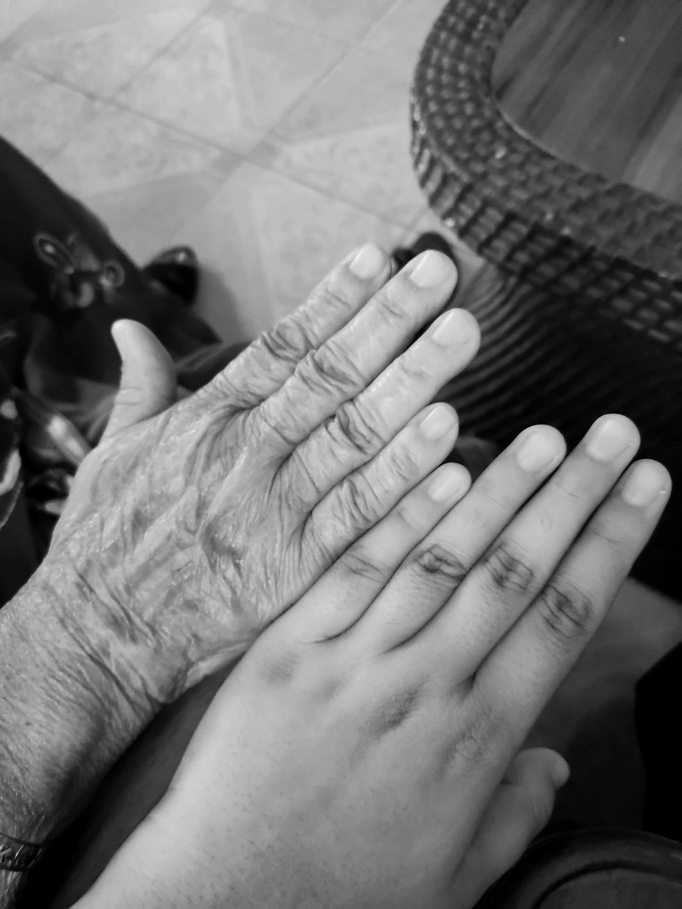 Aanchal’s tender hand, unmarked by time, contrasts gently with her grandmother’s hand.