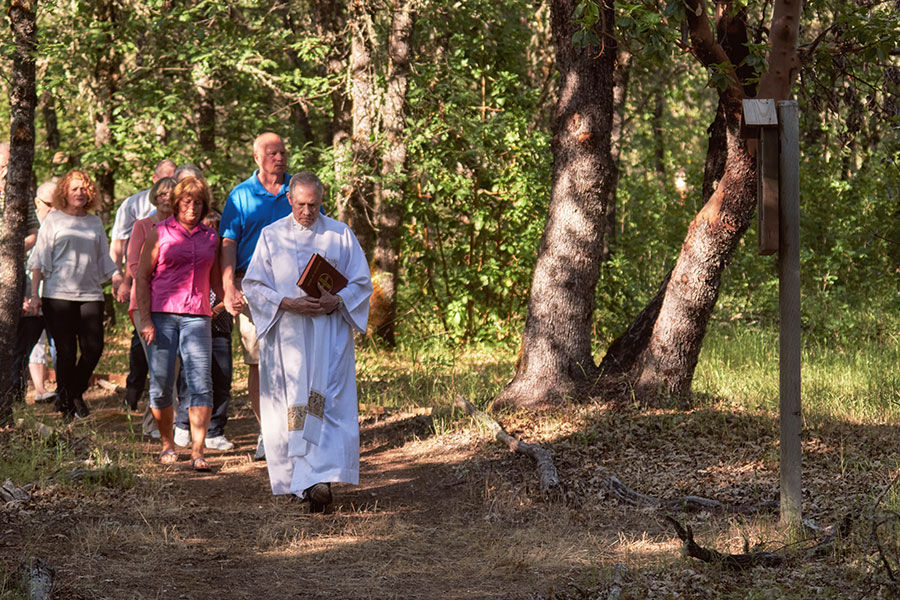 Fr. Clifford blesses the new Stations