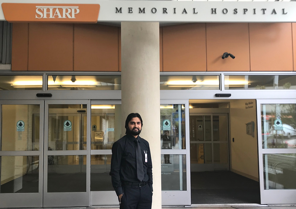 Br. Adnan in front of Sharp Memorial Hospital, where he is enrolled in CPE