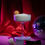 Thumbnail: Sloth in glass champagne coupe with disco ball and red velvet backdrop