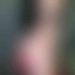 A meander or meandros pattern armband tattoo wrapped around female's ankle done in dotwork technique