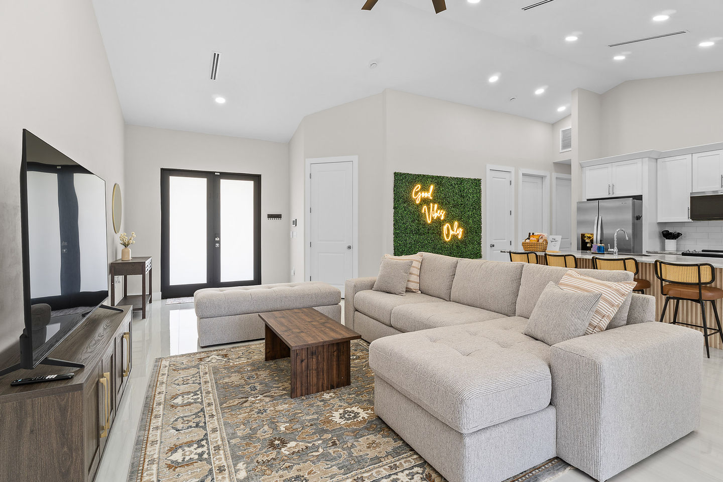 Bright and airy bedroom with large windows and modern furnishings